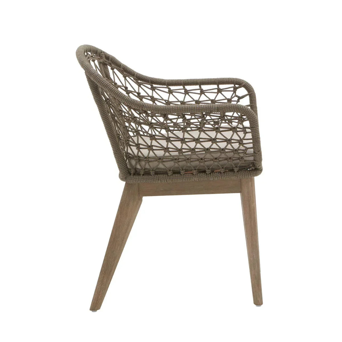 Side view of woven rattan dining chair with wooden legs and open weave backrest