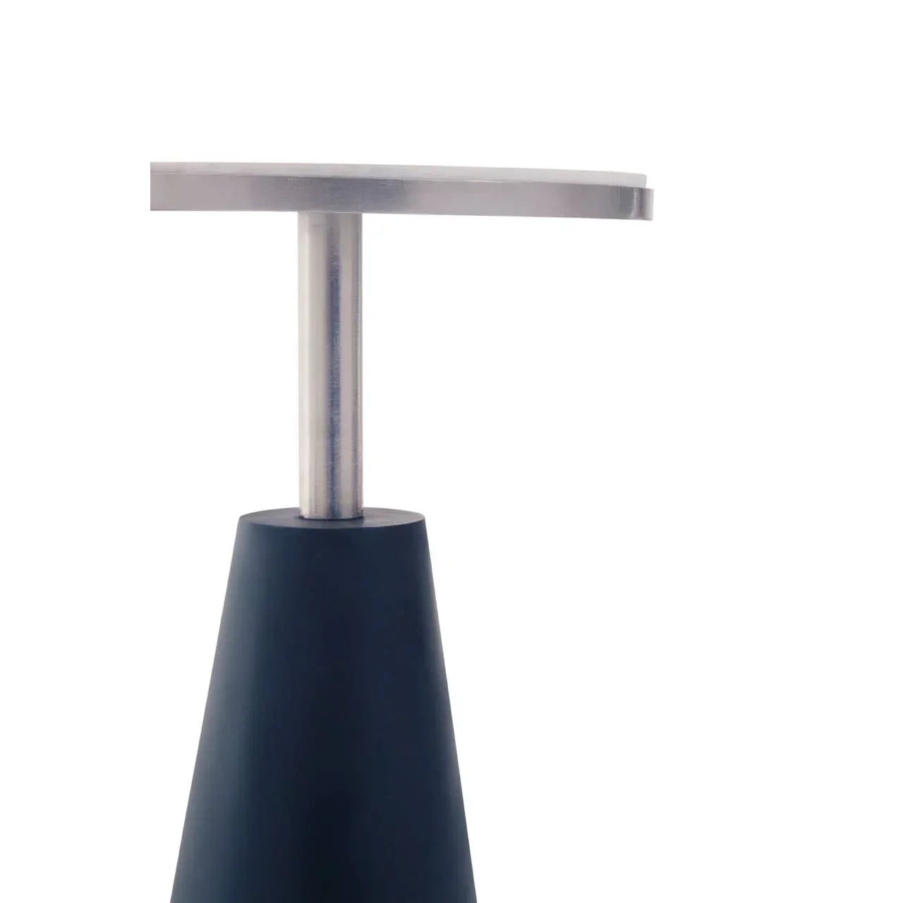 Close-up of metal and black modern table leg with conical base and round top