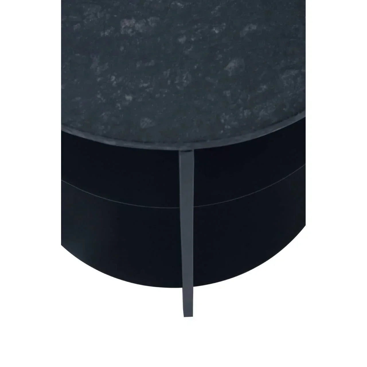 Close-up of round black coffee table with textured stone top and metal leg detail