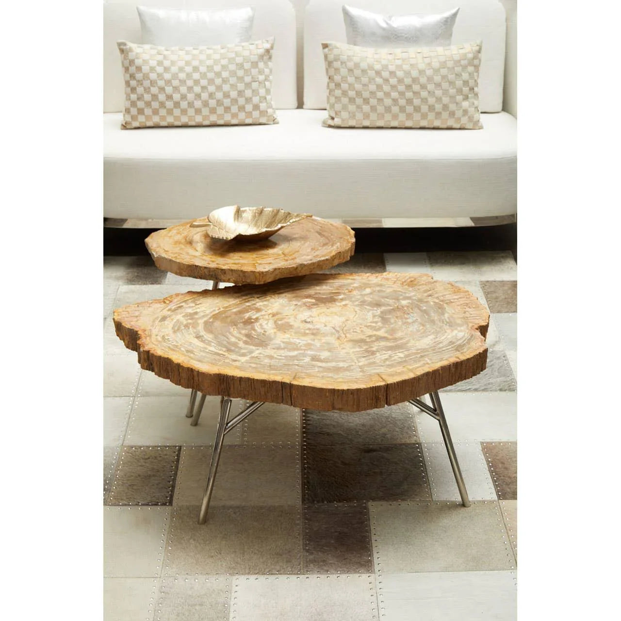 Natural wood coffee table with metal legs in front of cream sofa and geometric rug