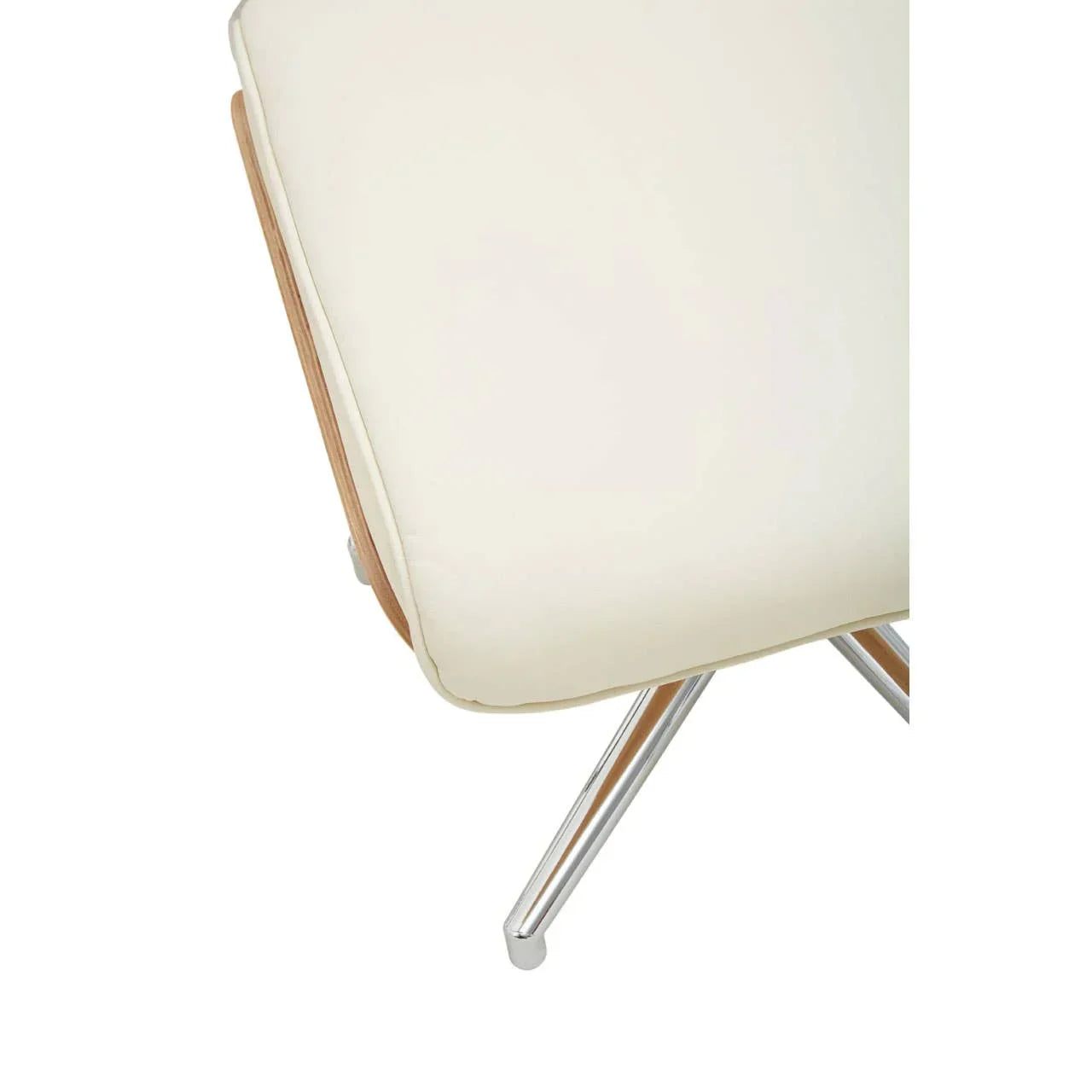 Closeup of cream cushioned chair seat with chrome angled legs and wooden trim