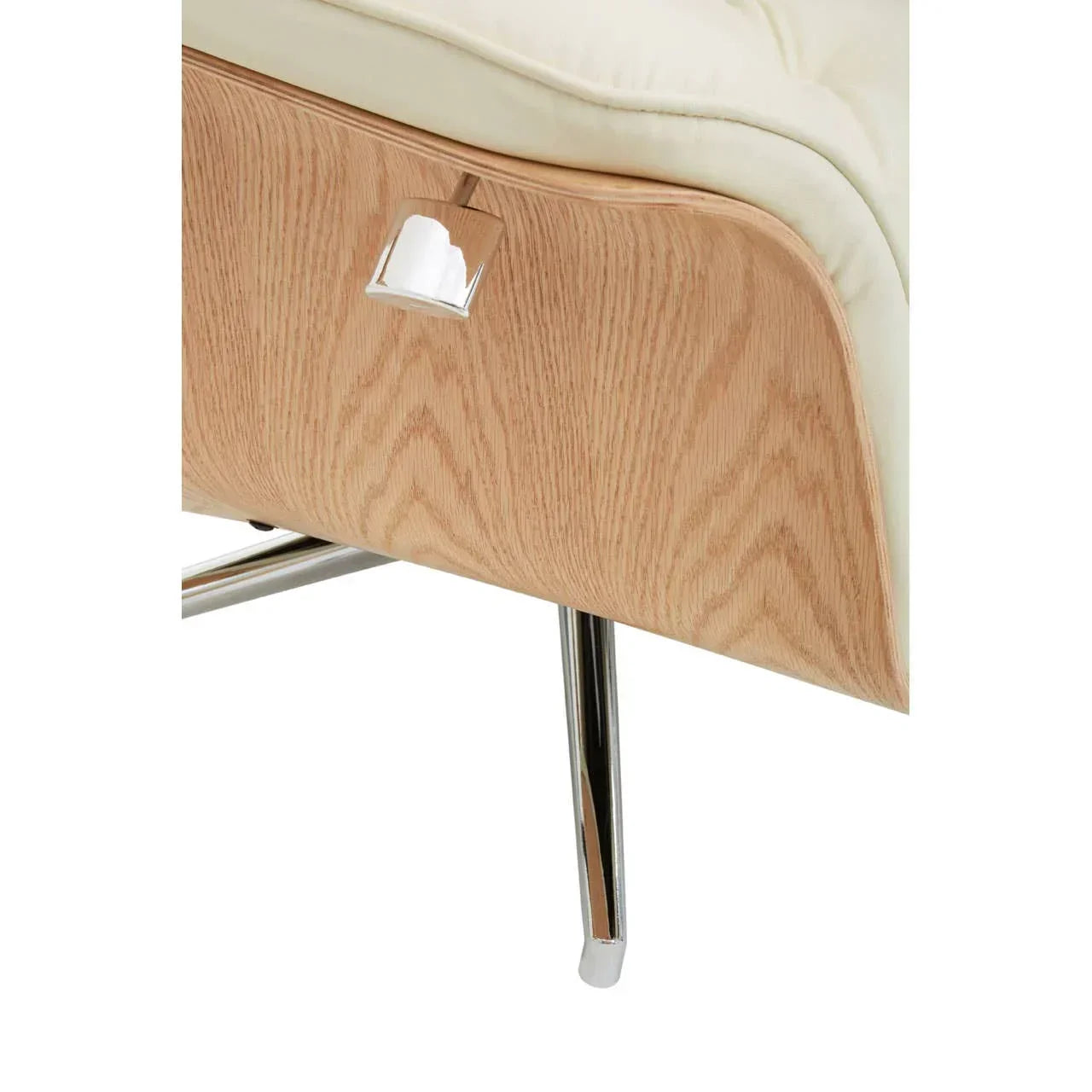 Beige leather chair with curved wood panel and chrome leg, modern furniture detail