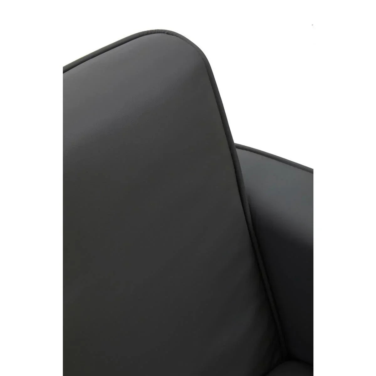 Closeup of dark grey leather sofa cushion and armrest with piped edge detail