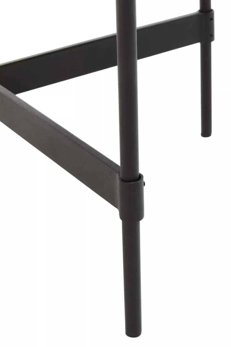 Black metal furniture leg with crossbar detail, close up view