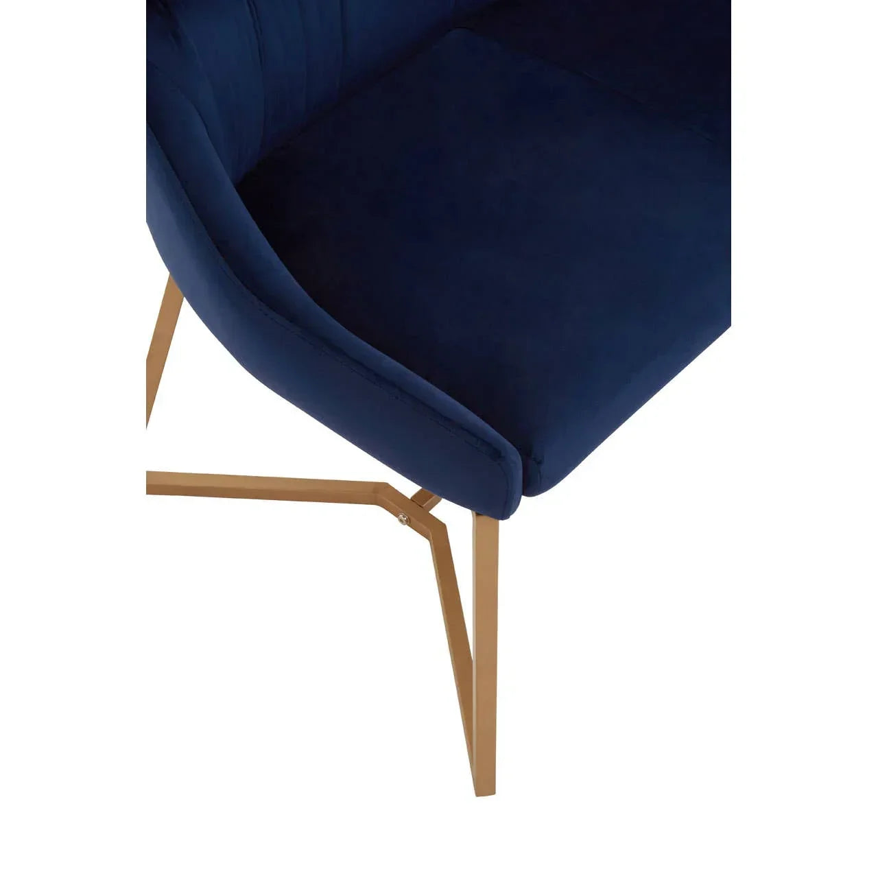 Navy velvet dining chair with gold metal legs, close-up of seat and angled frame