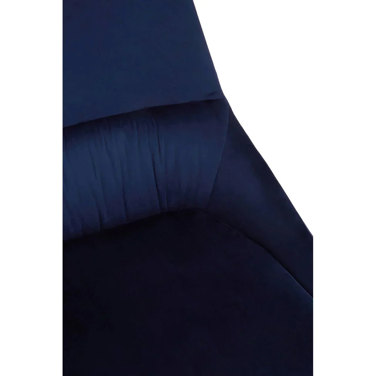Closeup of navy velvet sofa seat with soft cushioning and curved backrest
