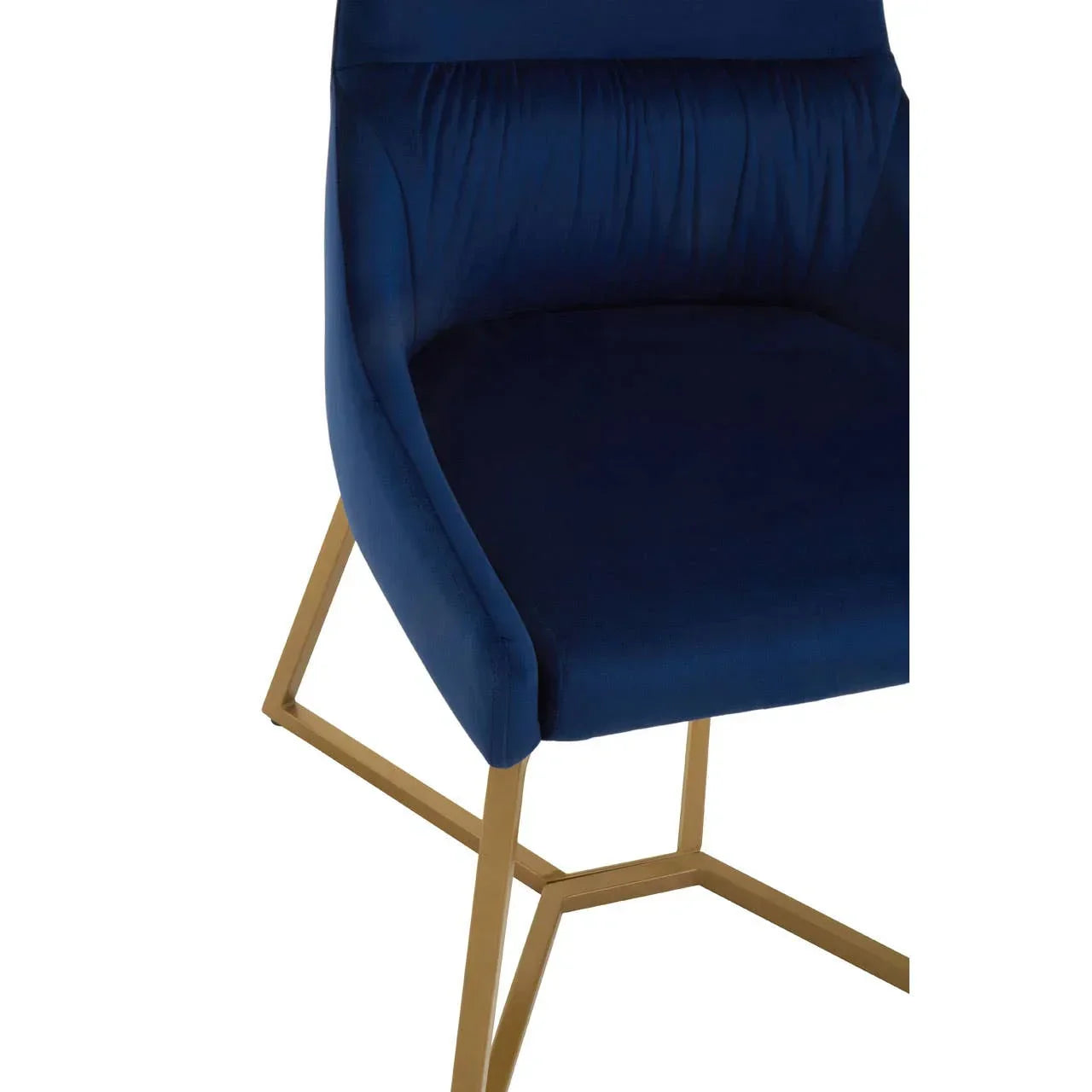 Blue velvet dining chair with gold metal legs, close view of seat and base