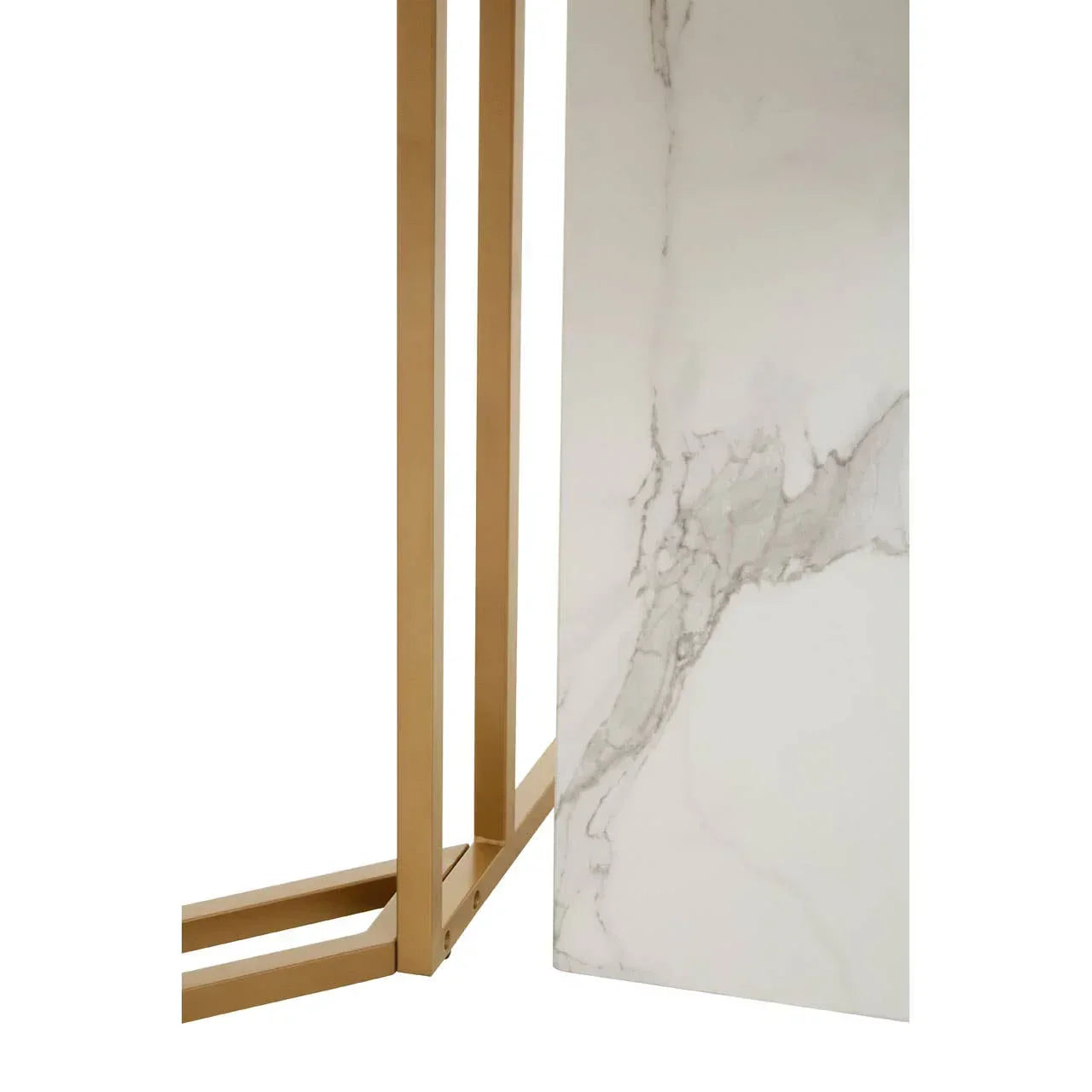 Marble dining table corner with gold metal legs and white veined surface detail