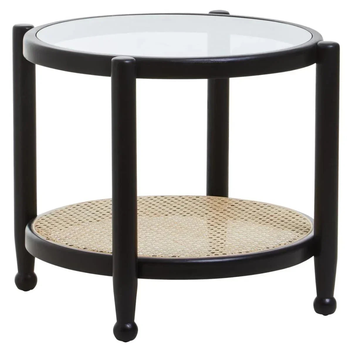 Round glass top side table with black frame and rattan shelf, photographed at an angle