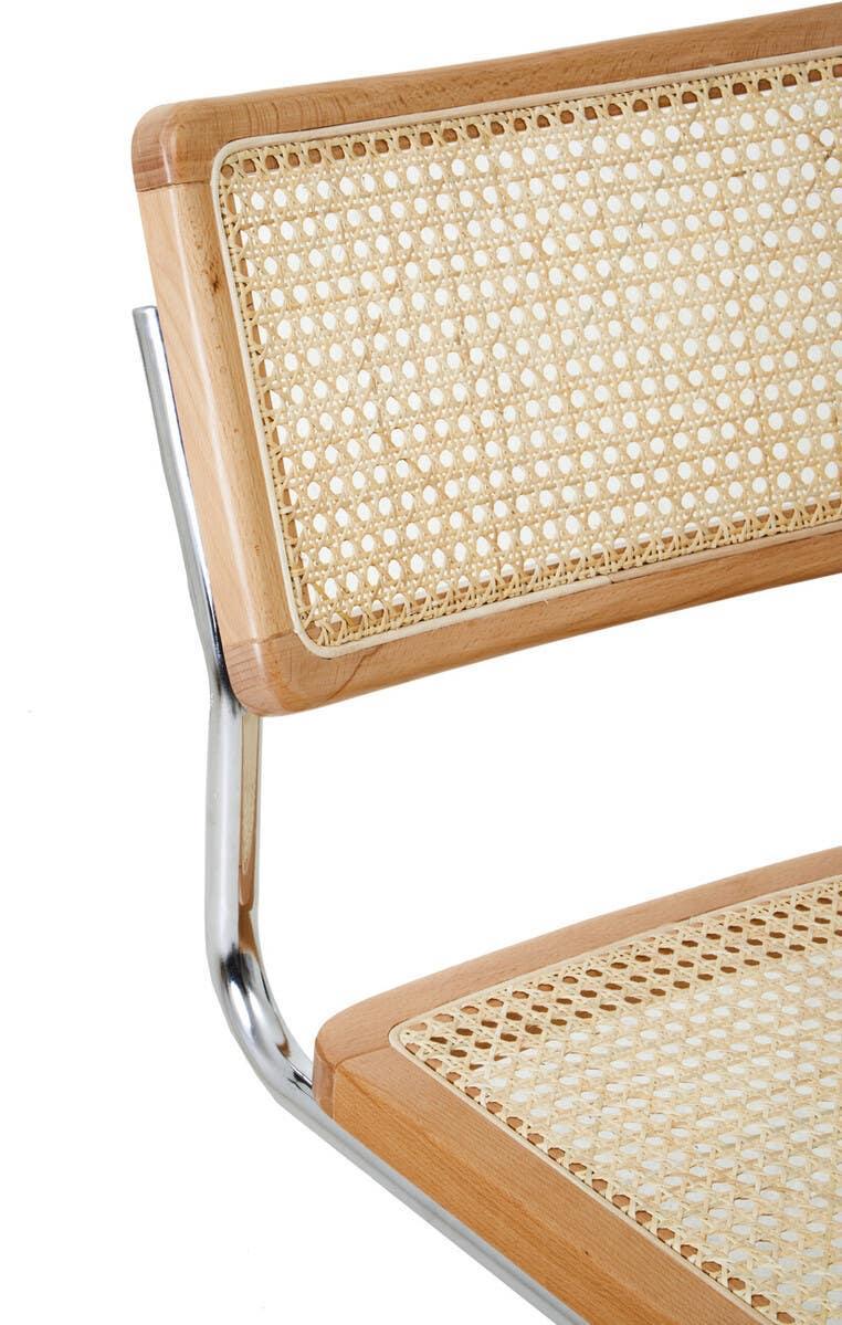 Cane and wood dining chair with chrome frame, close view of seat and backrest