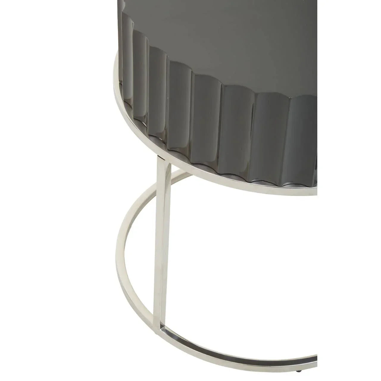 Round side table with glossy grey fluted top and silver metal frame, close-up view
