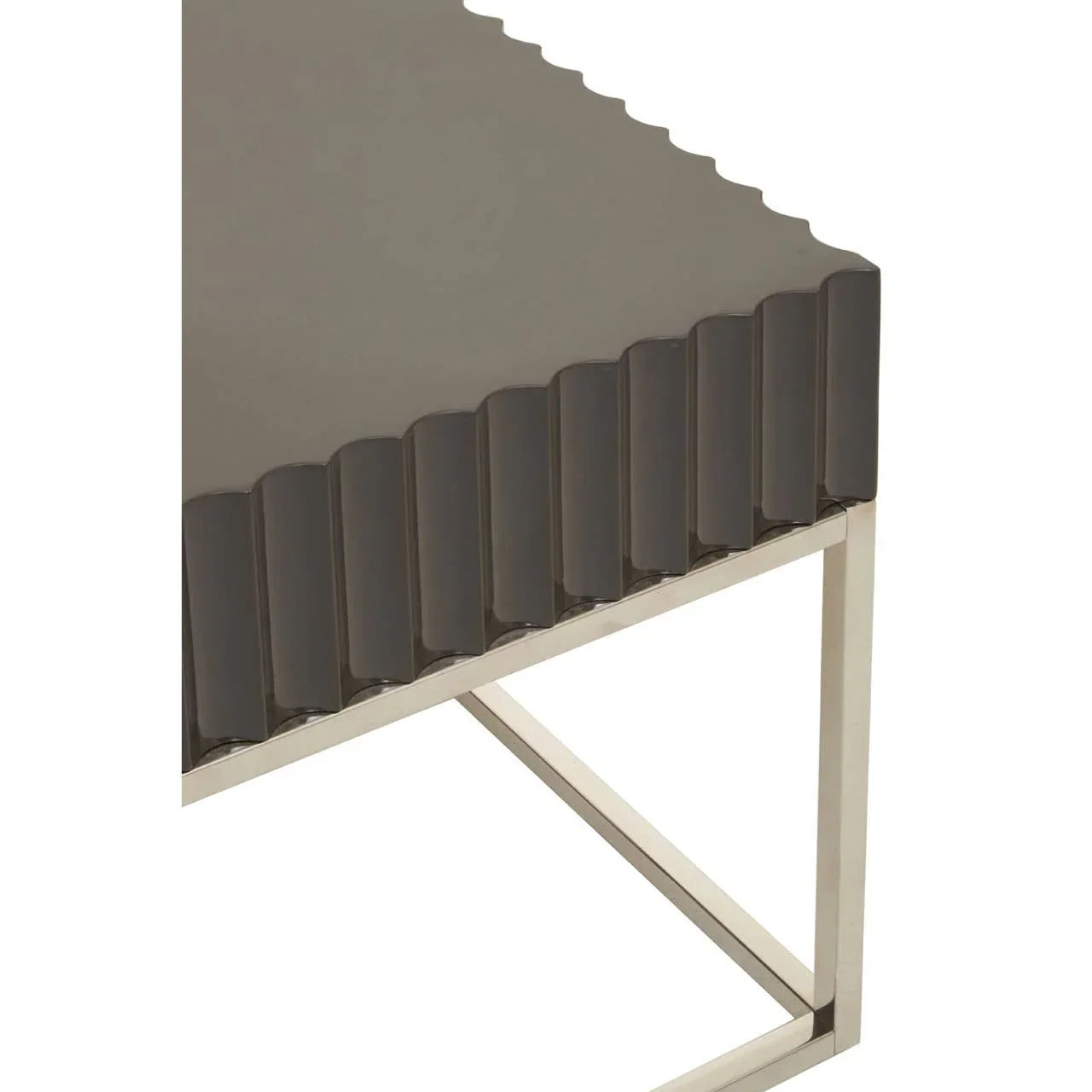Modern coffee table with glossy fluted dark top and metal frame, corner closeup