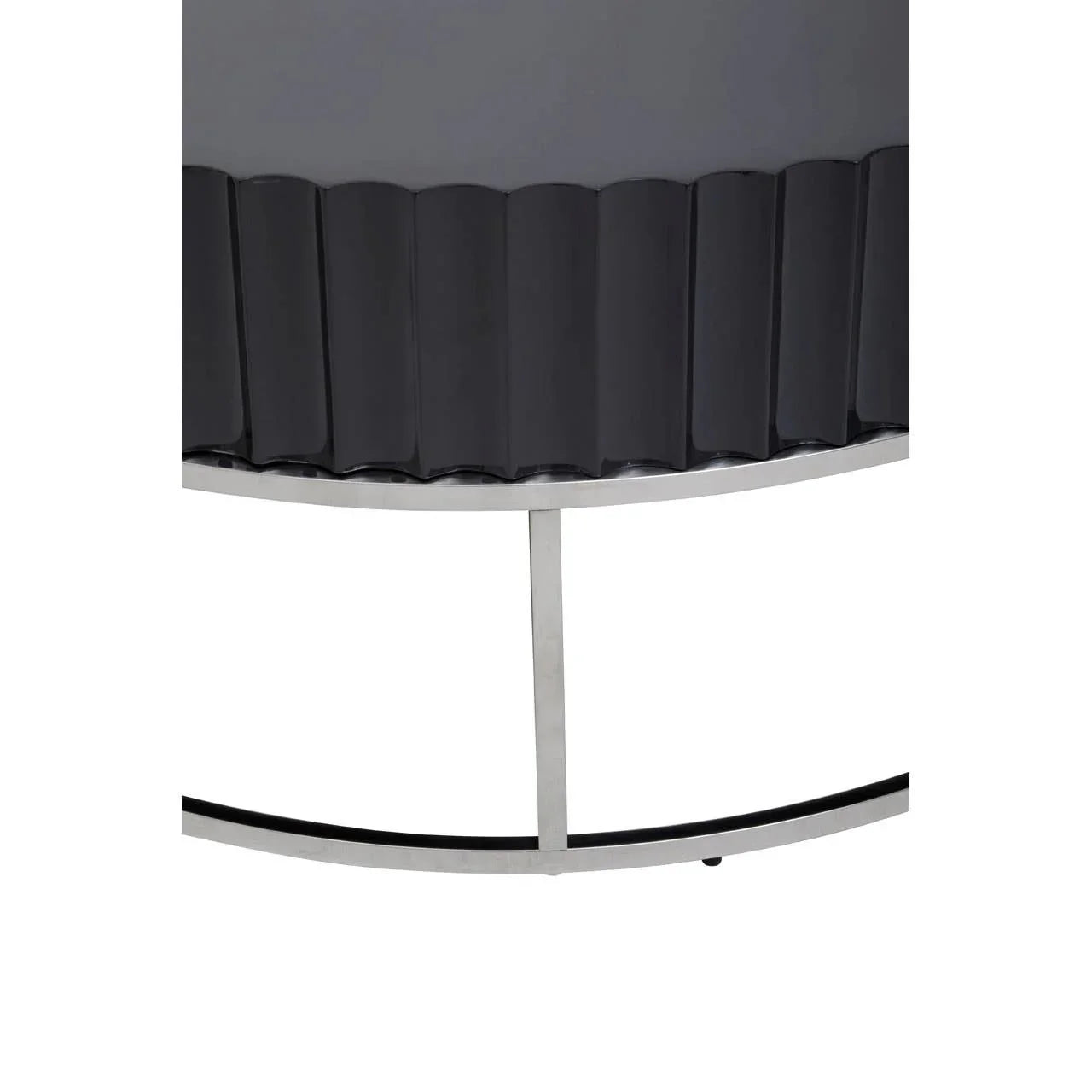 Close-up of black fluted console table with silver metal base