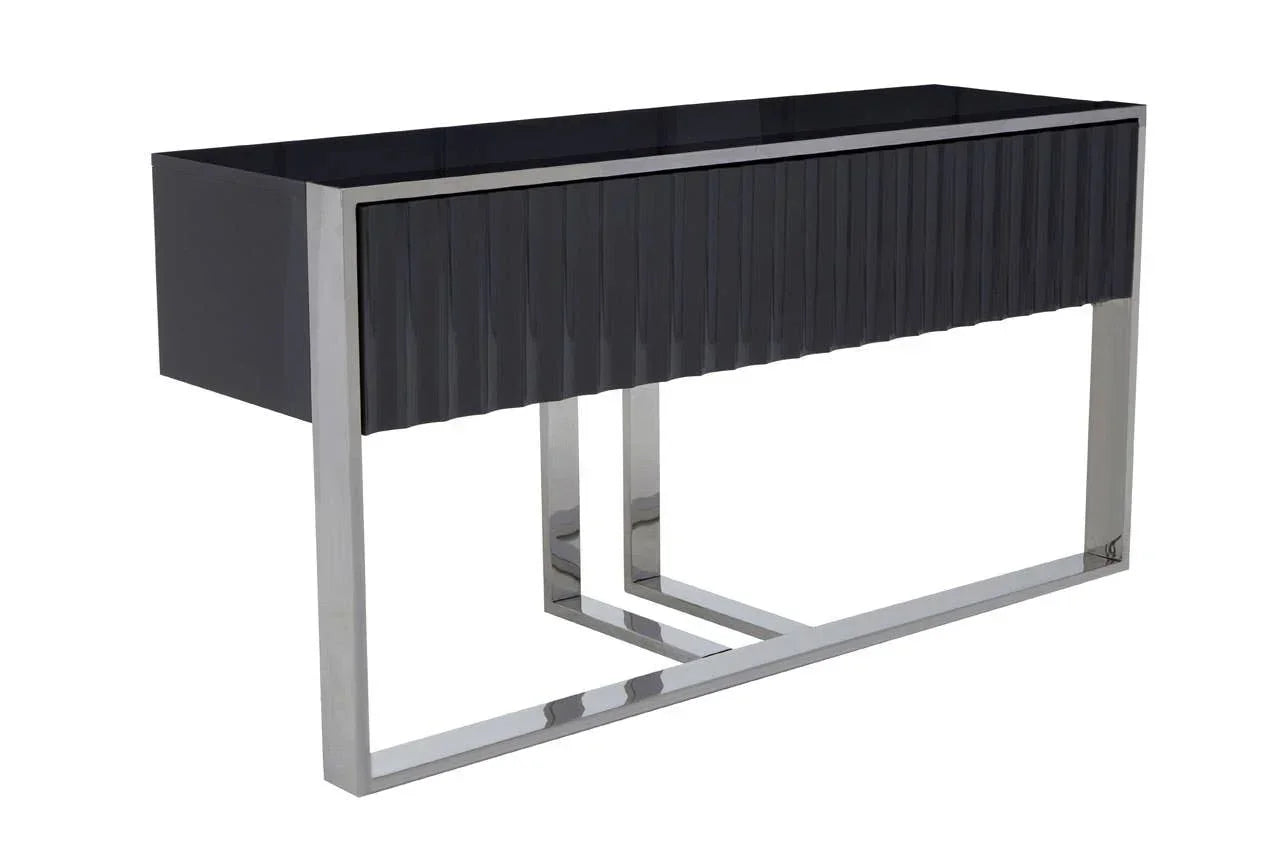 Black console table with fluted front and chrome metal frame, angled side view