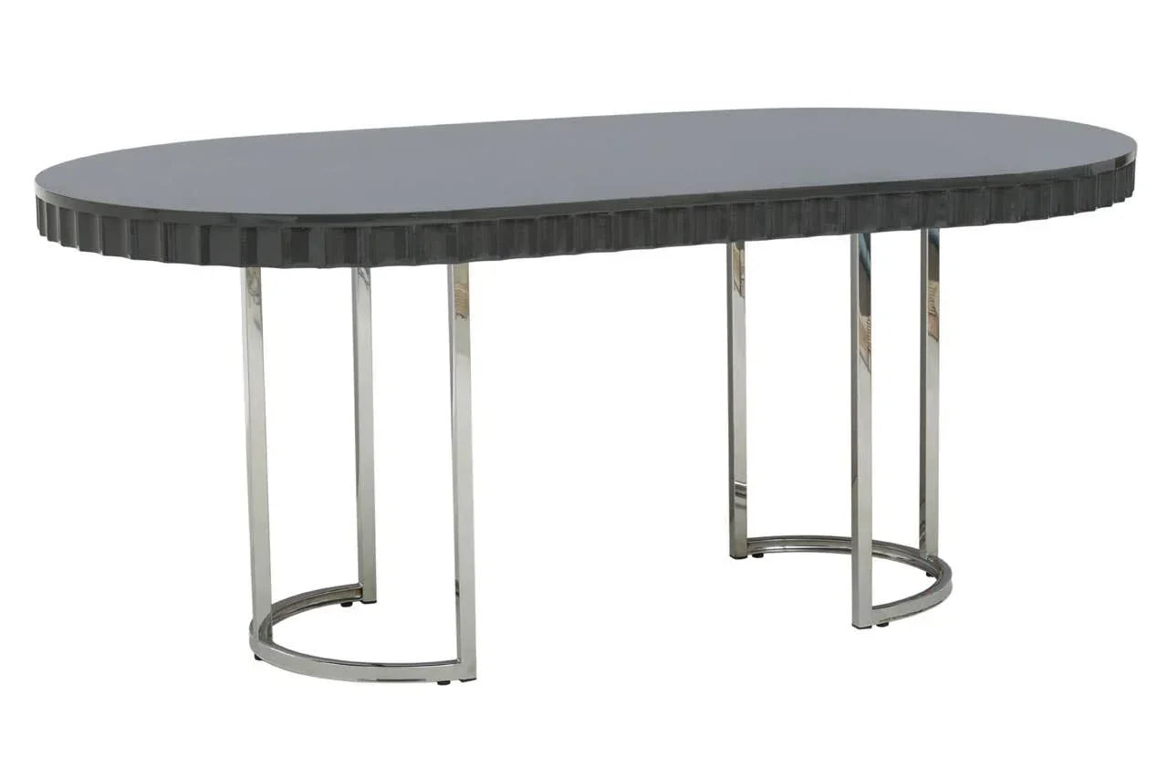 Oval black dining table with chrome metal legs and textured edge detail