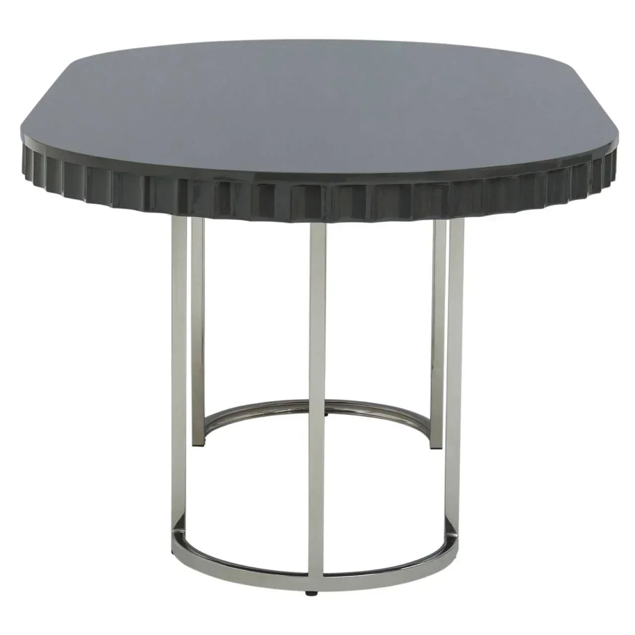 Modern dining table with black geometric top and chrome metal legs, front angle view