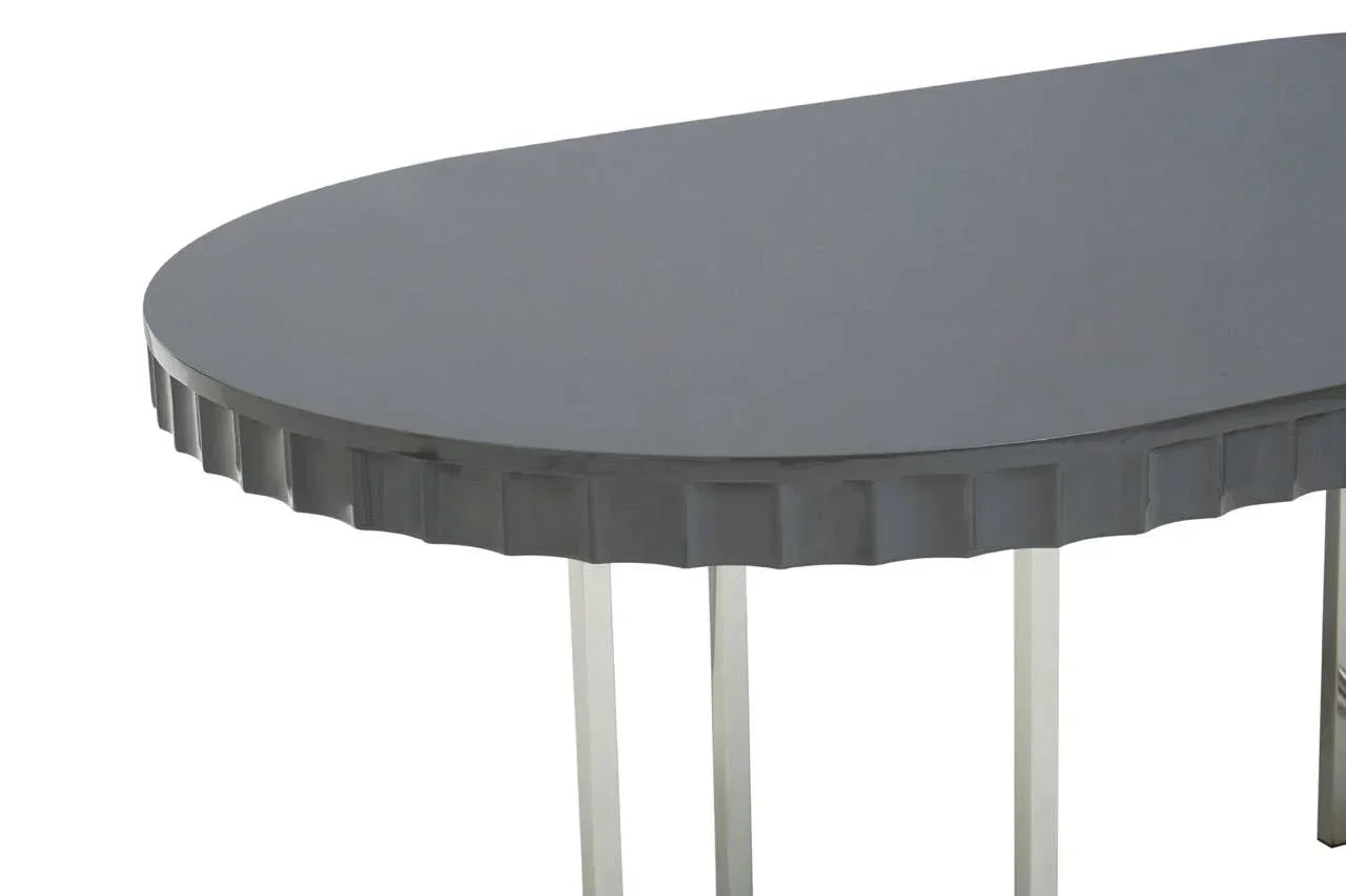 Grey oval table with textured edge and metal legs, close up of tabletop and corner