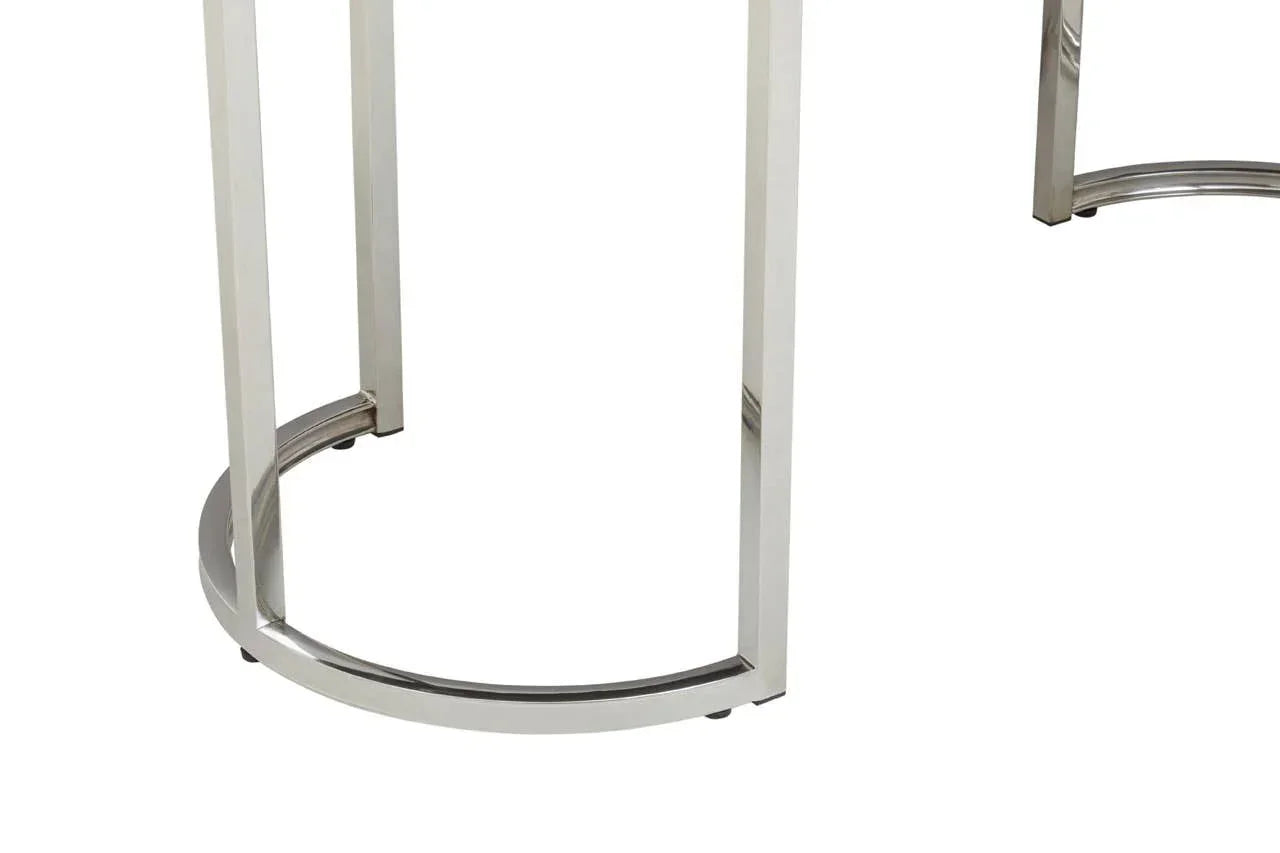 Close-up of chrome metal table legs with curved base support