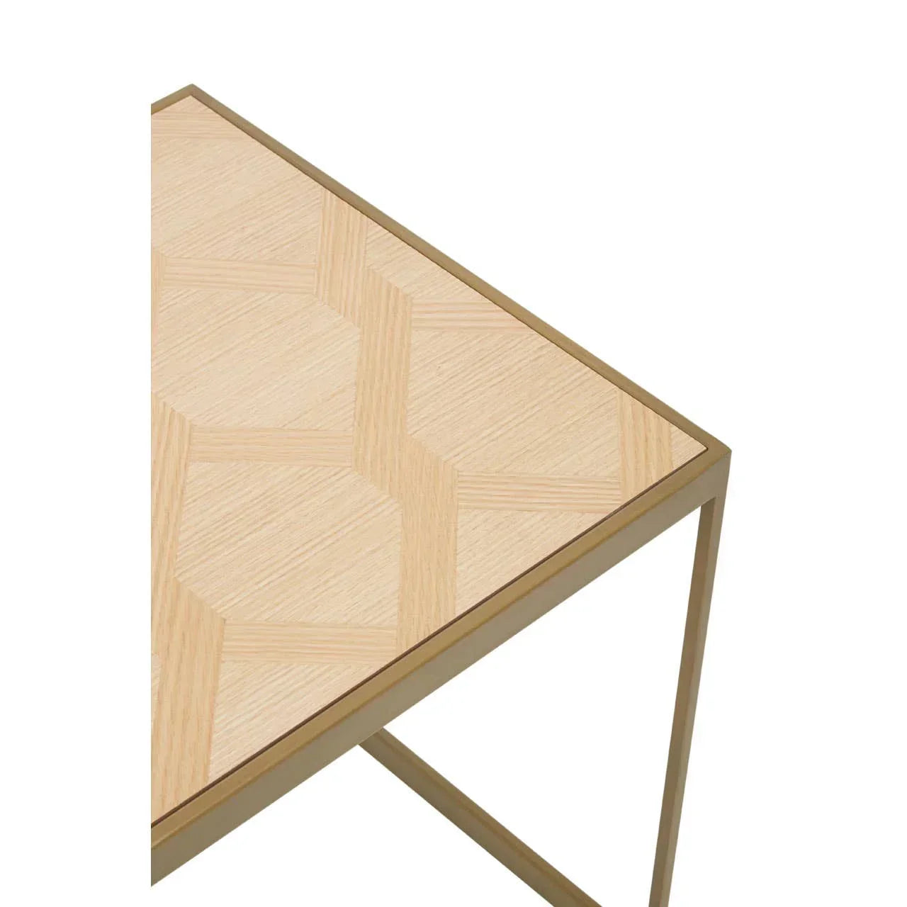 Light wood side table with geometric pattern and gold metal frame, corner detail view