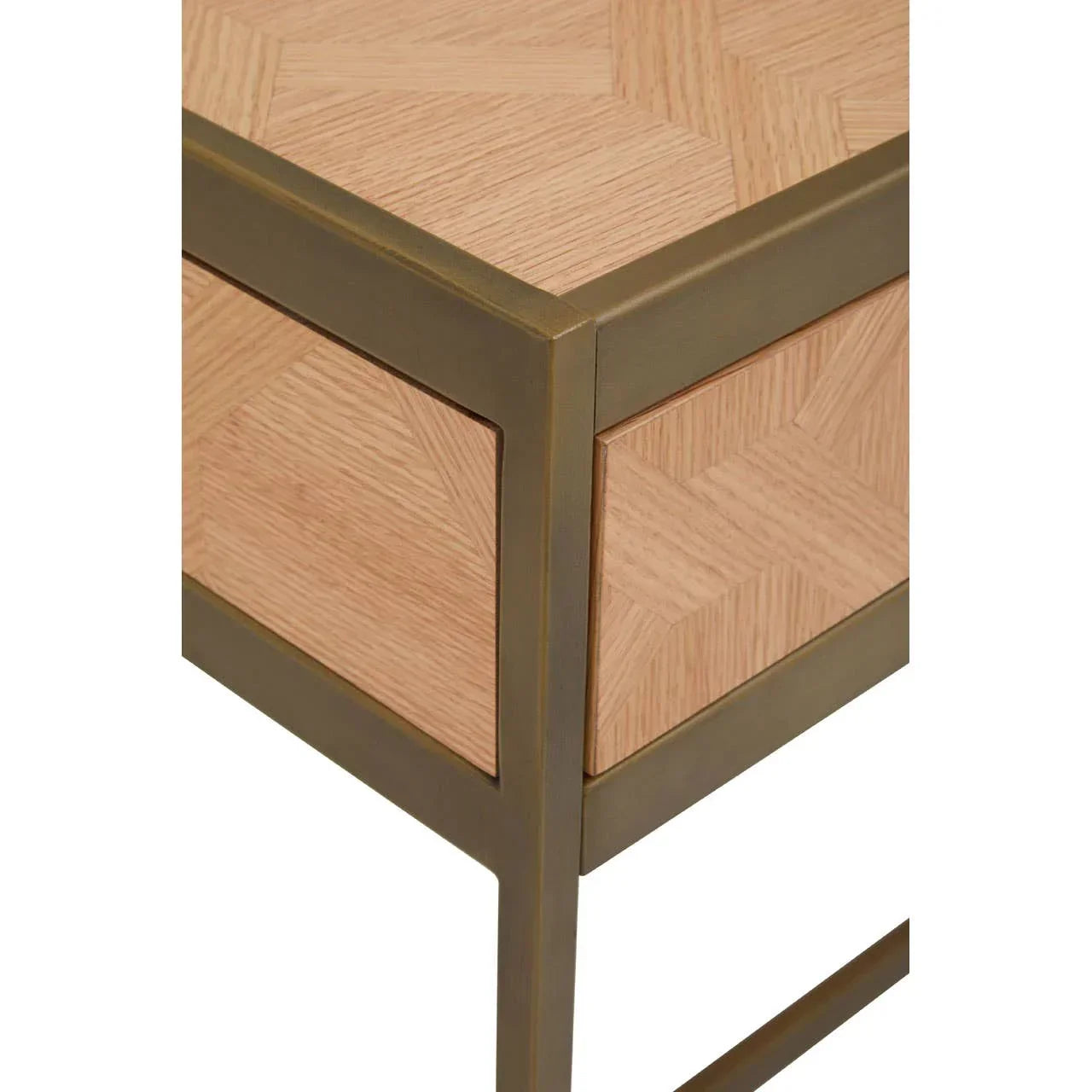 Close up of wooden side table with brass frame and geometric veneer pattern