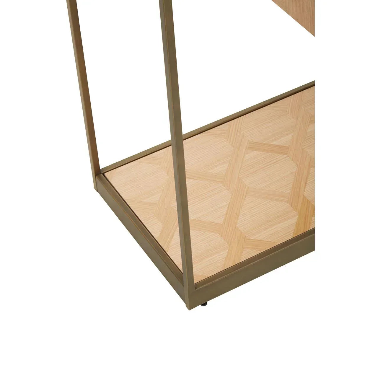 Close-up of wooden shelving unit with gold metal frame and geometric patterned shelf base
