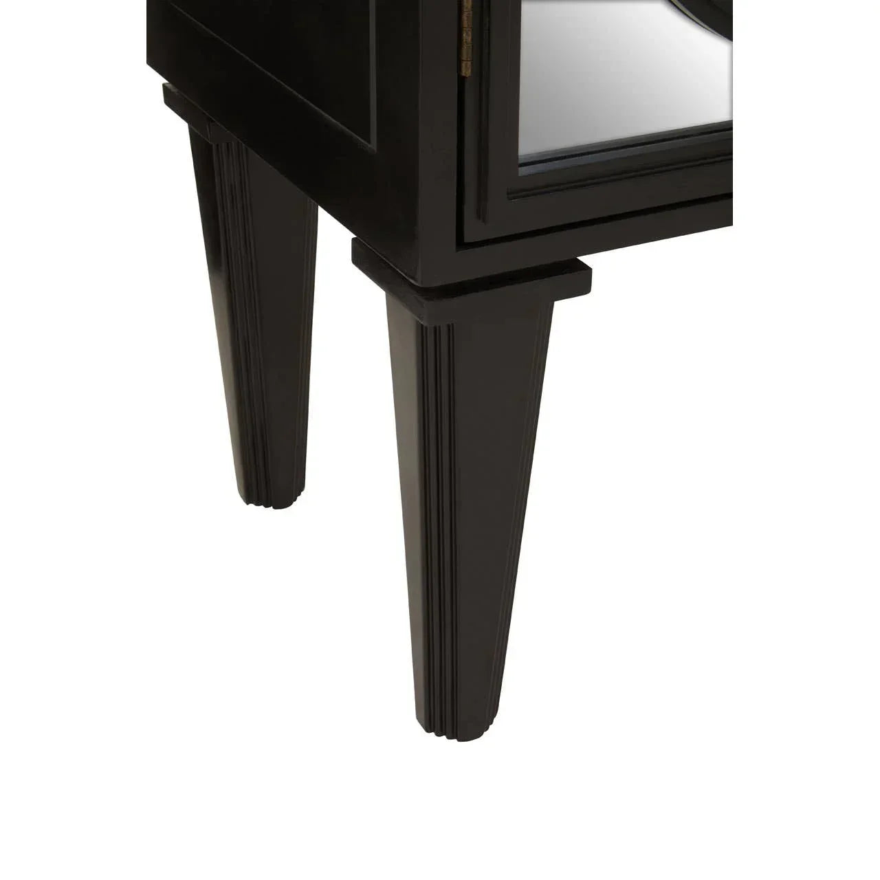 Black wooden furniture legs and mirrored cabinet panel detail