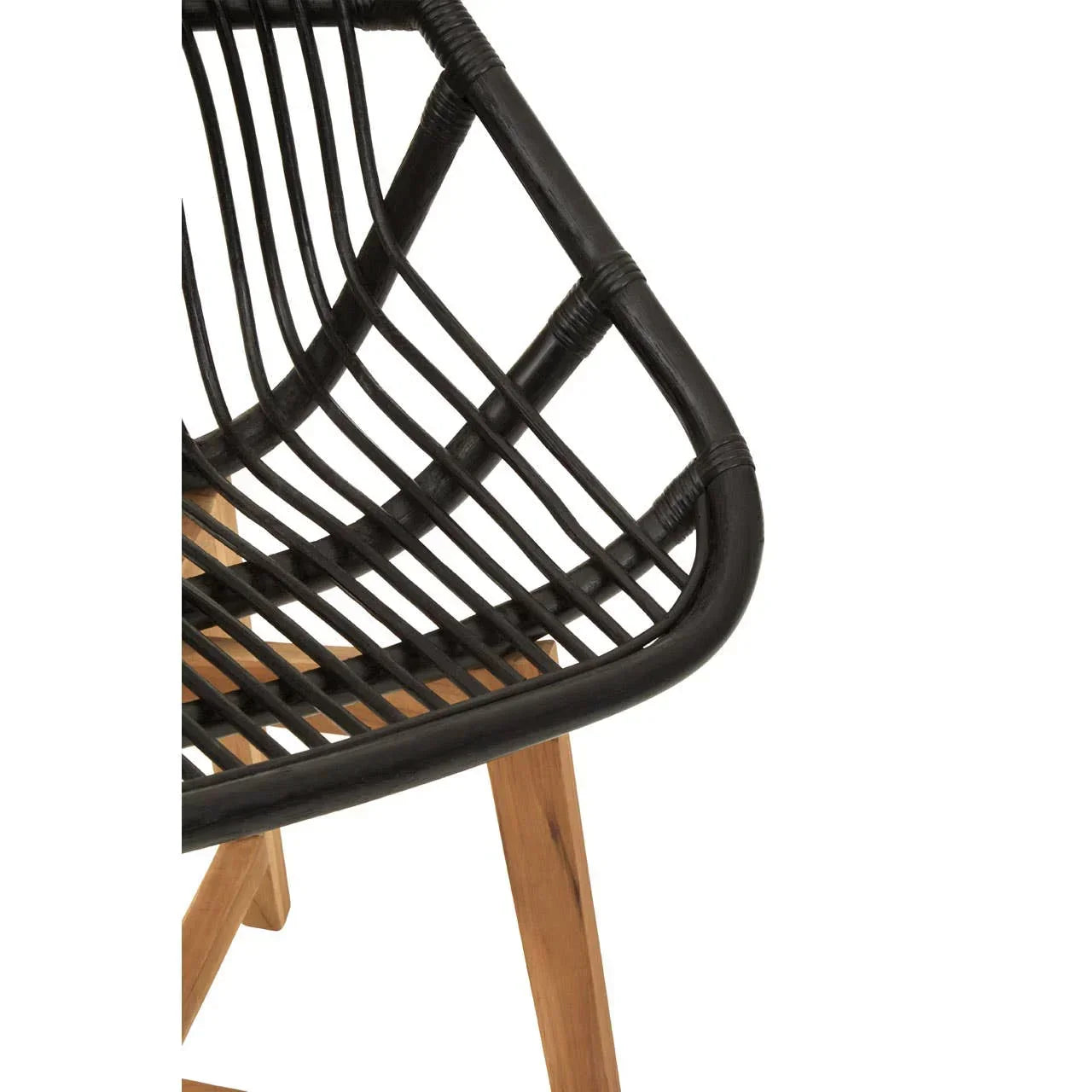 Closeup of black rattan dining chair with wooden legs and angled seat design