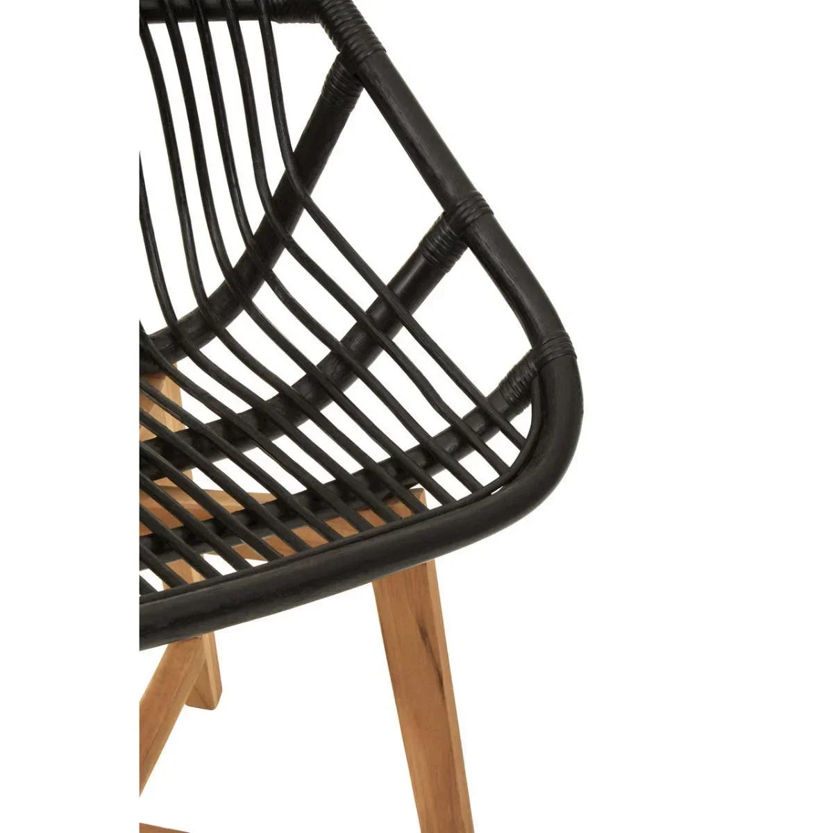 Closeup of black rattan chair with wooden legs and open weave seat design