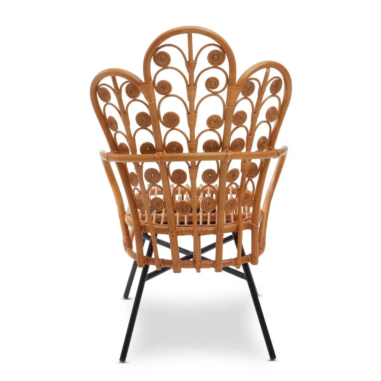 Curved rattan armchair with intricate scrollwork back and black metal legs, rear view