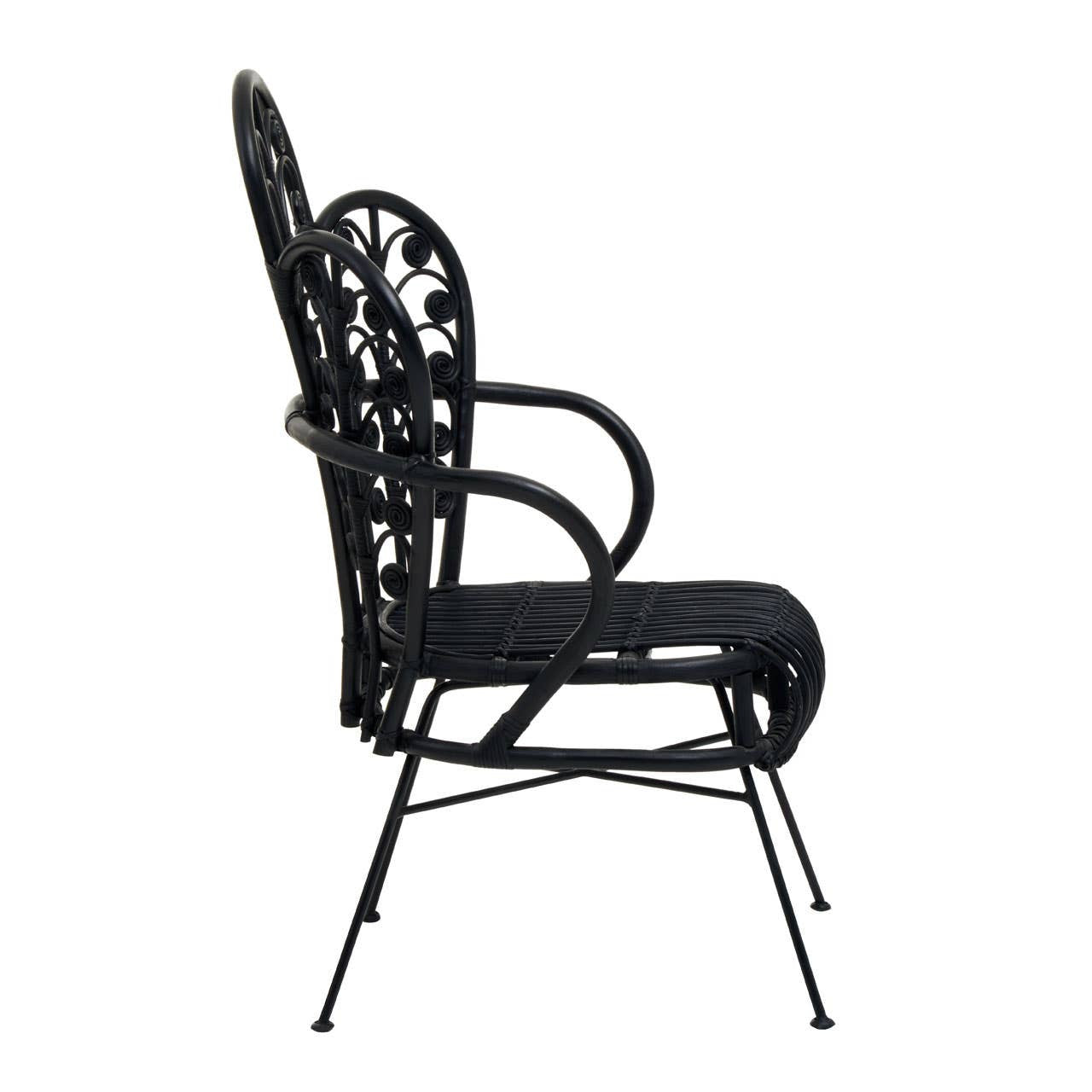 A side view of a black rattan chair featuring a scalloped back design, slender armrests, and a cushioned seat, supported by thin metal legs