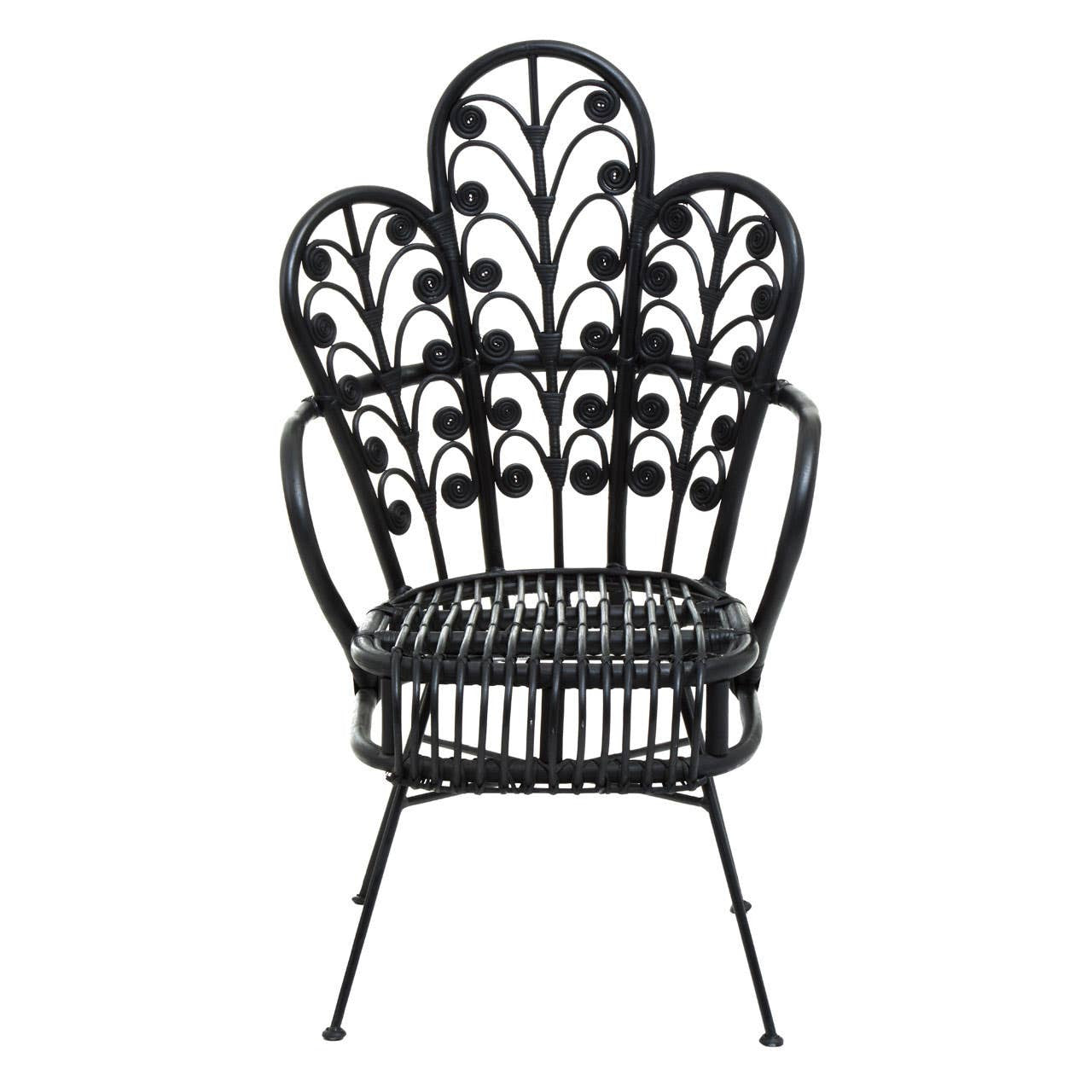 A black rattan chair with a scalloped back design featuring intricate leaf patterns, supported by slender metal legs. The chair has a wide seat and a distinctive, artistic silhouette that adds a stylish touch to any space