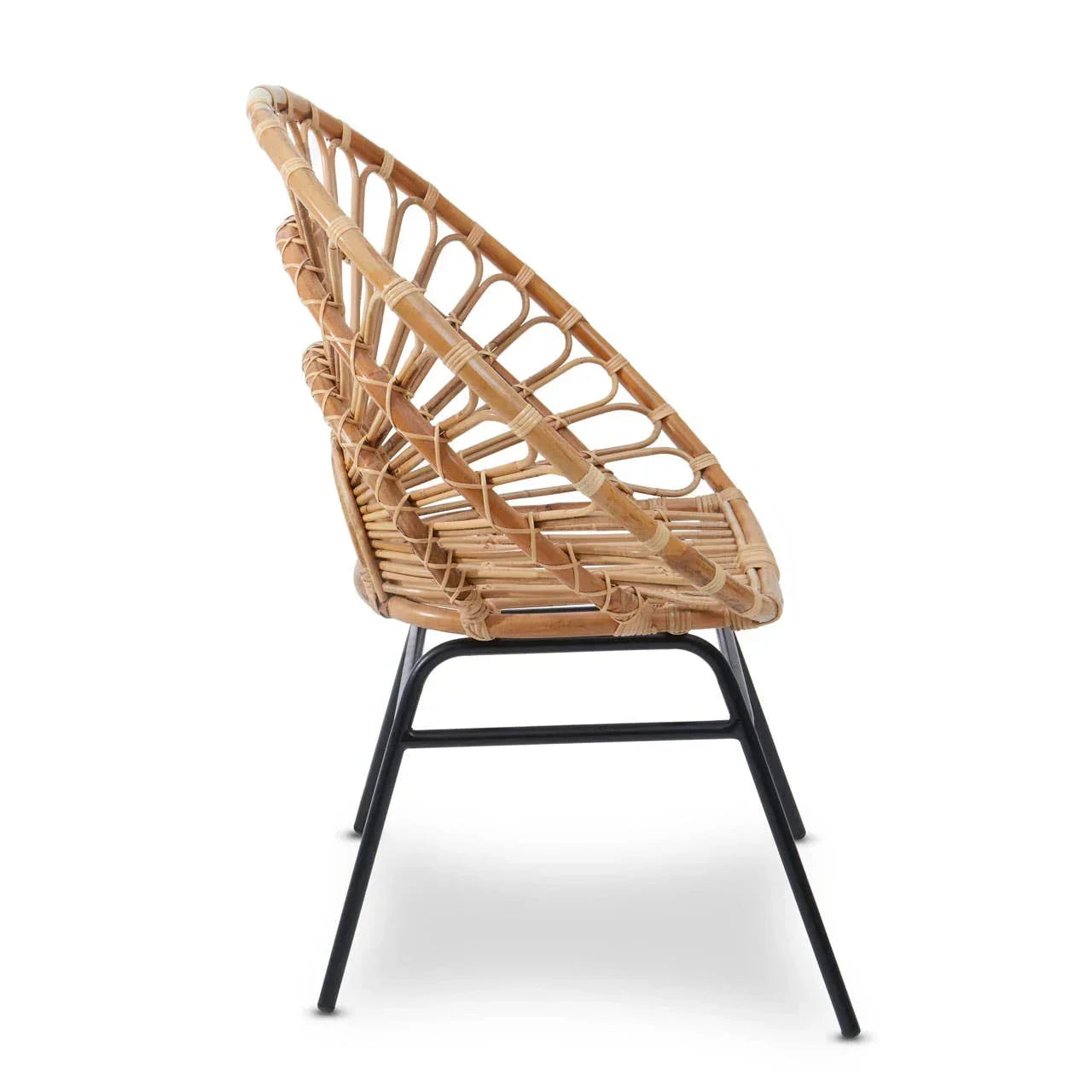 Side view of rattan accent chair with black metal legs and open weave design