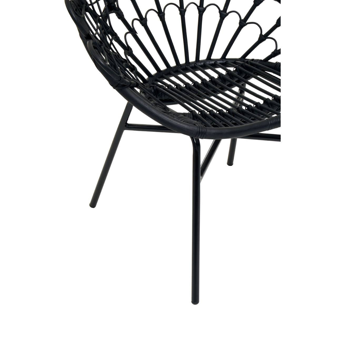A close-up view of the Java Black Natural Rattan Peacock Chair, showcasing its intricate rattan weaving and sleek black metal legs. The chair features a rounded back with a fan-like design, emphasizing its bohemian style and elegant curves