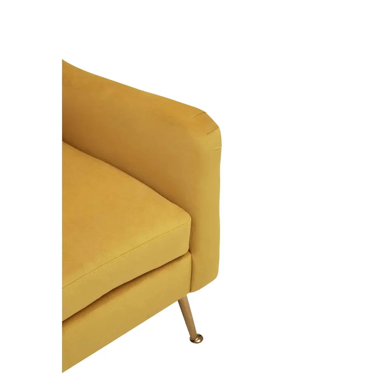 Mustard yellow sofa corner with metal leg and box cushion, close-up view