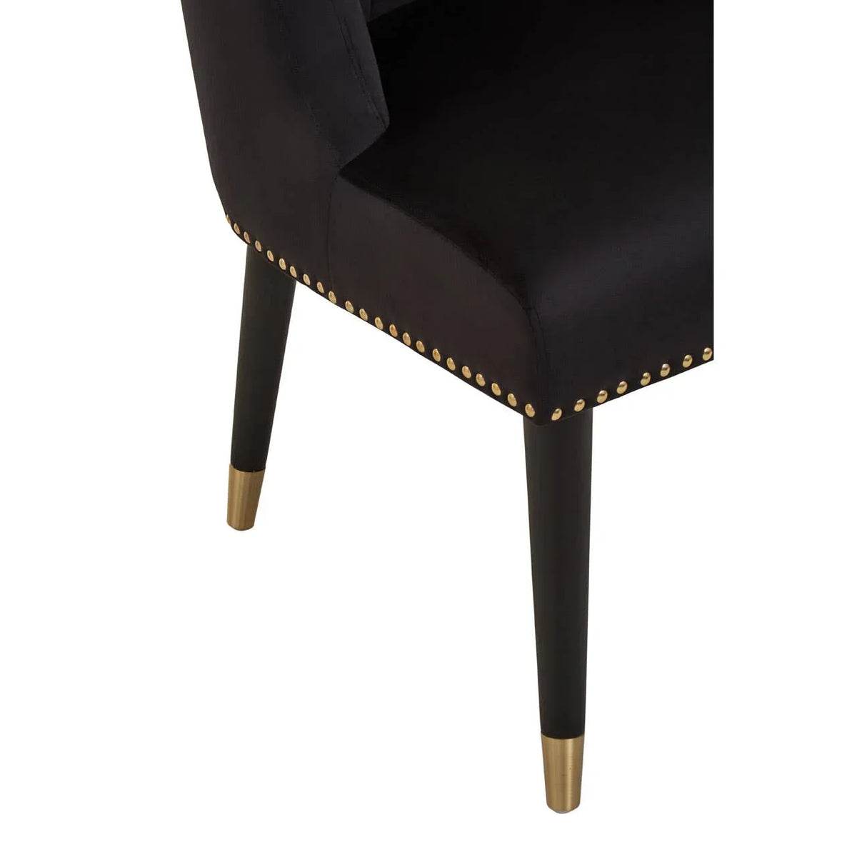 Black velvet dining chair seat with gold stud trim and tapered black legs with gold tips