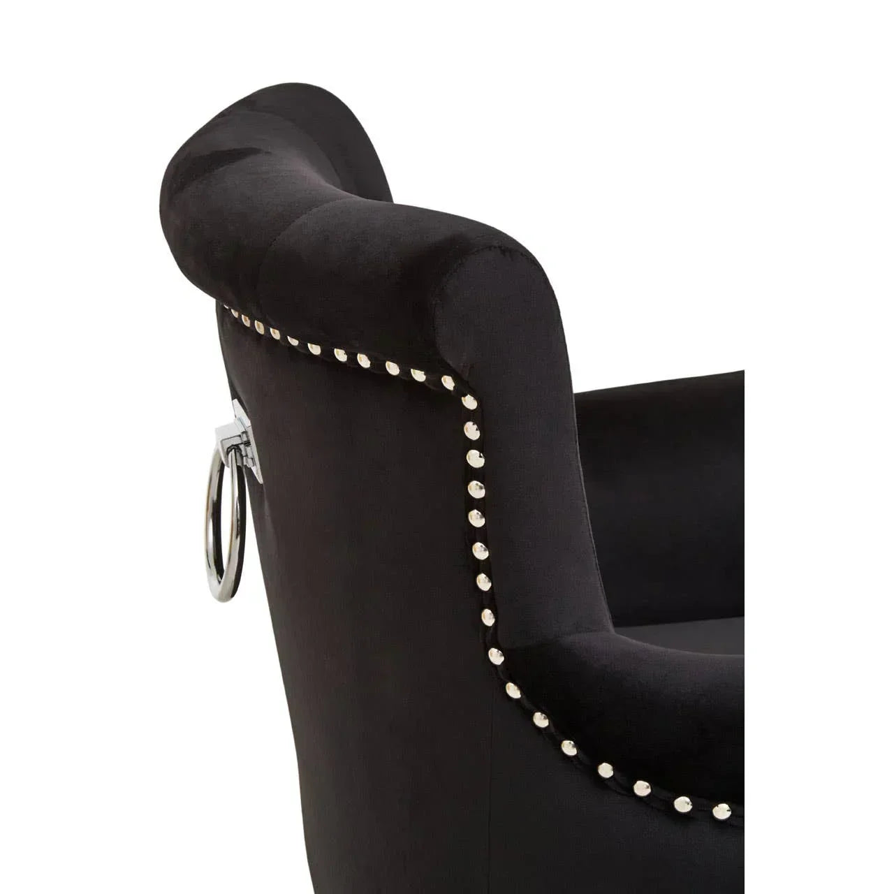 Black velvet accent chair with silver stud detailing and chrome ring handle on backrest