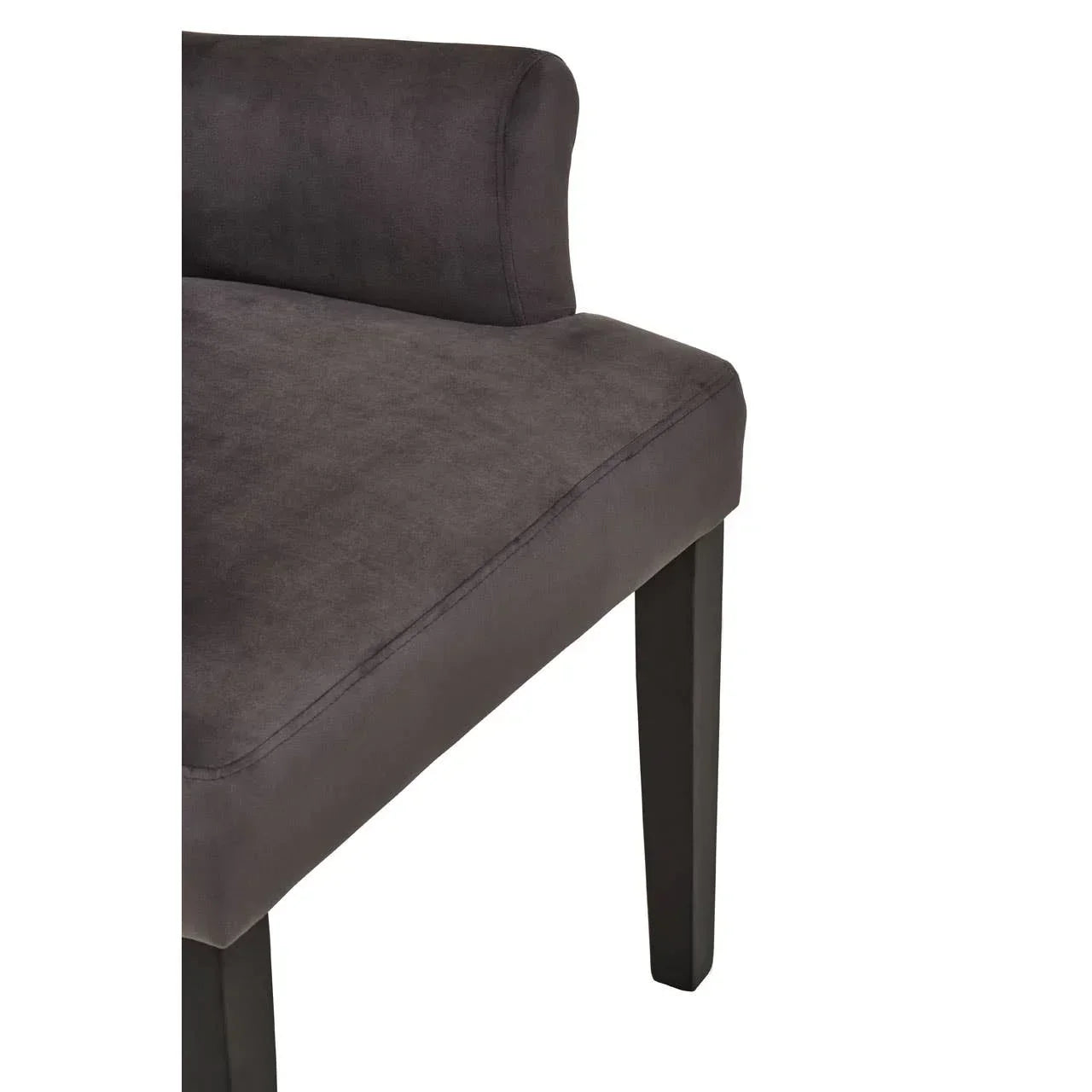 Dark grey upholstered dining chair with cushioned seat and black wooden legs, side view