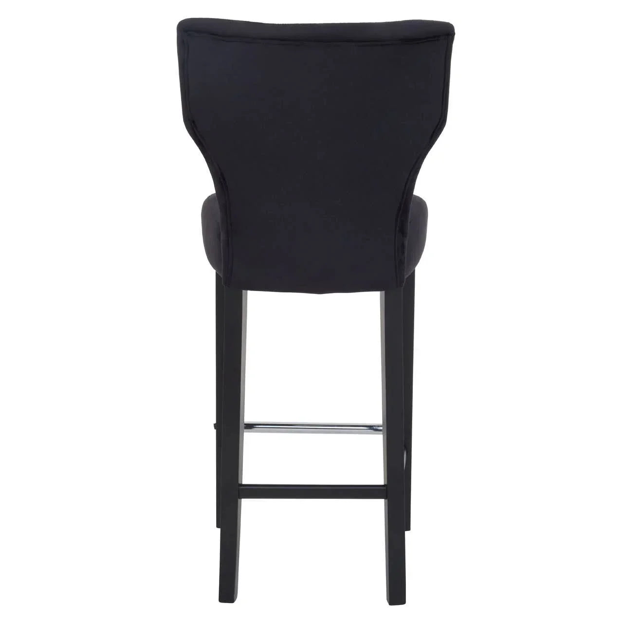 Rear view of black upholstered bar stool with high back and dark wooden legs