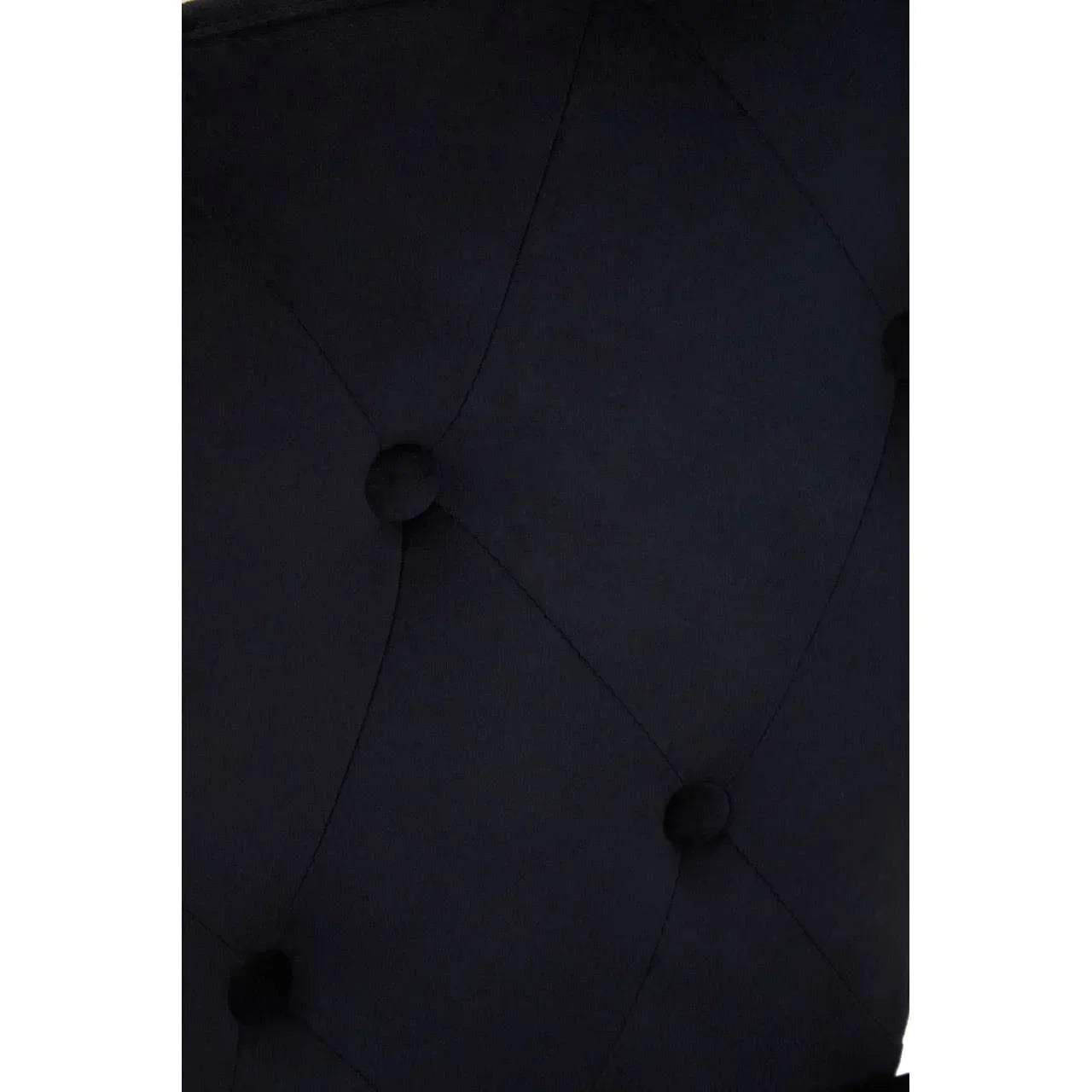 Black velvet sofa upholstery with deep button tufted detail