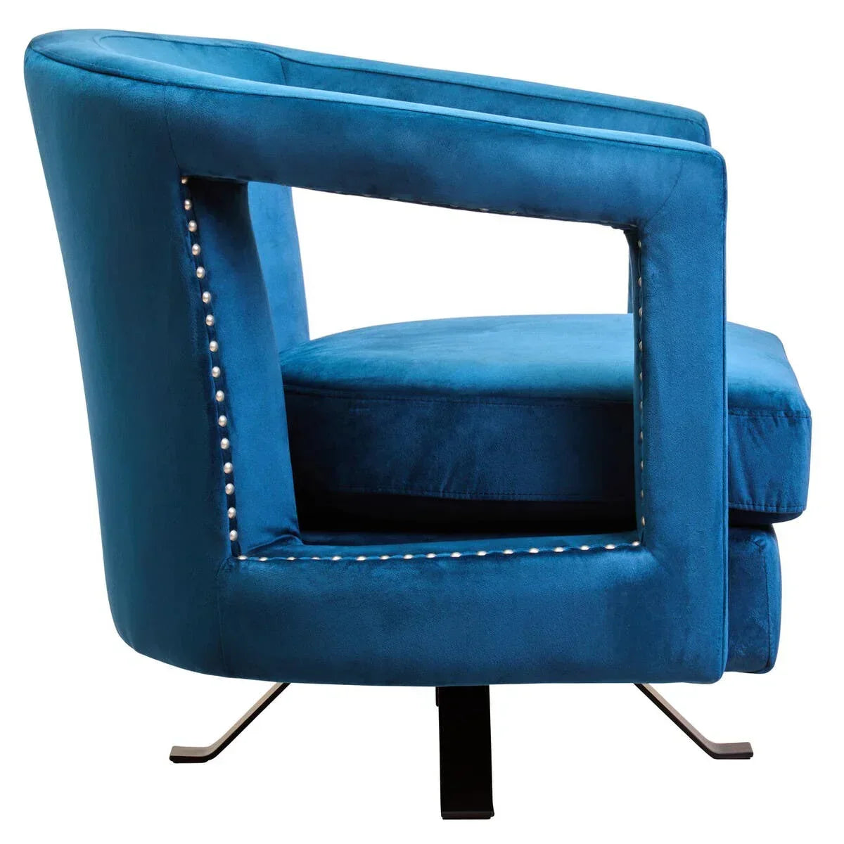 Blue velvet accent chair with open arm design, silver stud detailing, and swivel base, side view