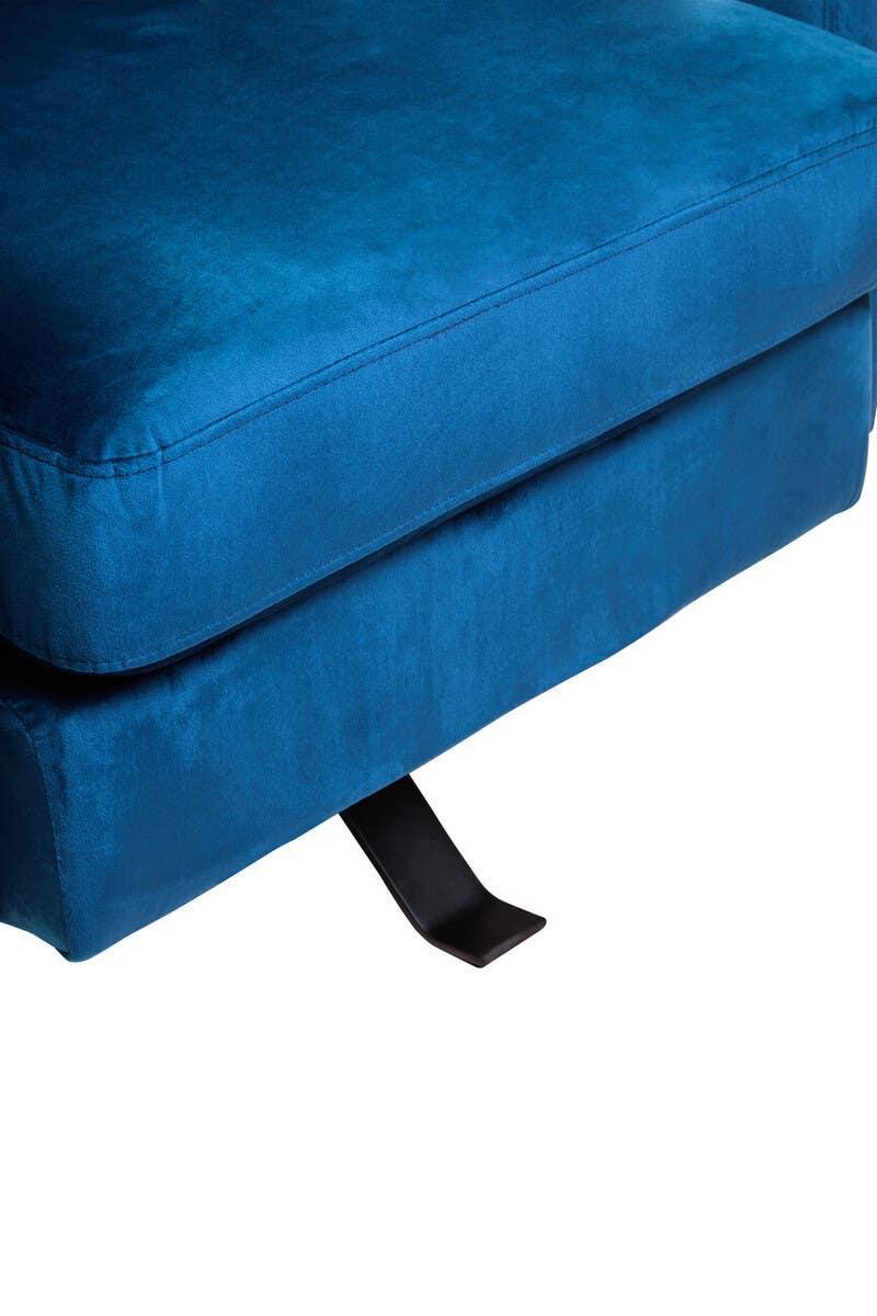 Close-up of blue velvet sofa seat with visible metal reclining lever