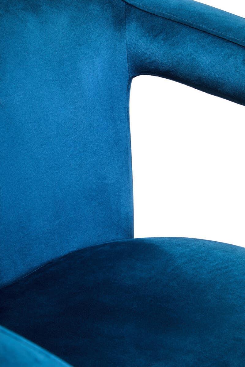 Close-up of blue velvet armchair backrest and seat upholstery