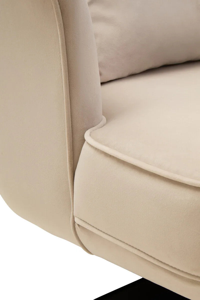 Close-up of beige fabric sofa armrest and cushion detail
