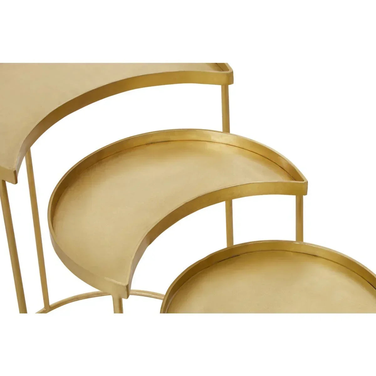 Gold nesting tables with crescent shaped metal trays, close-up of surface and edges