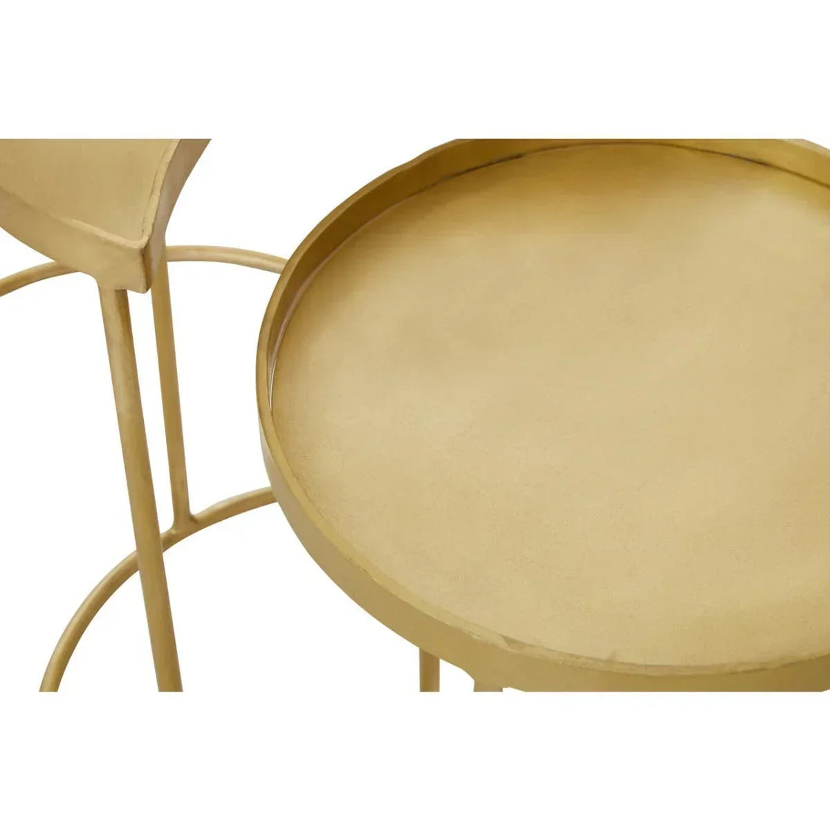 Round gold metal side table with raised edge and slim legs, close-up view