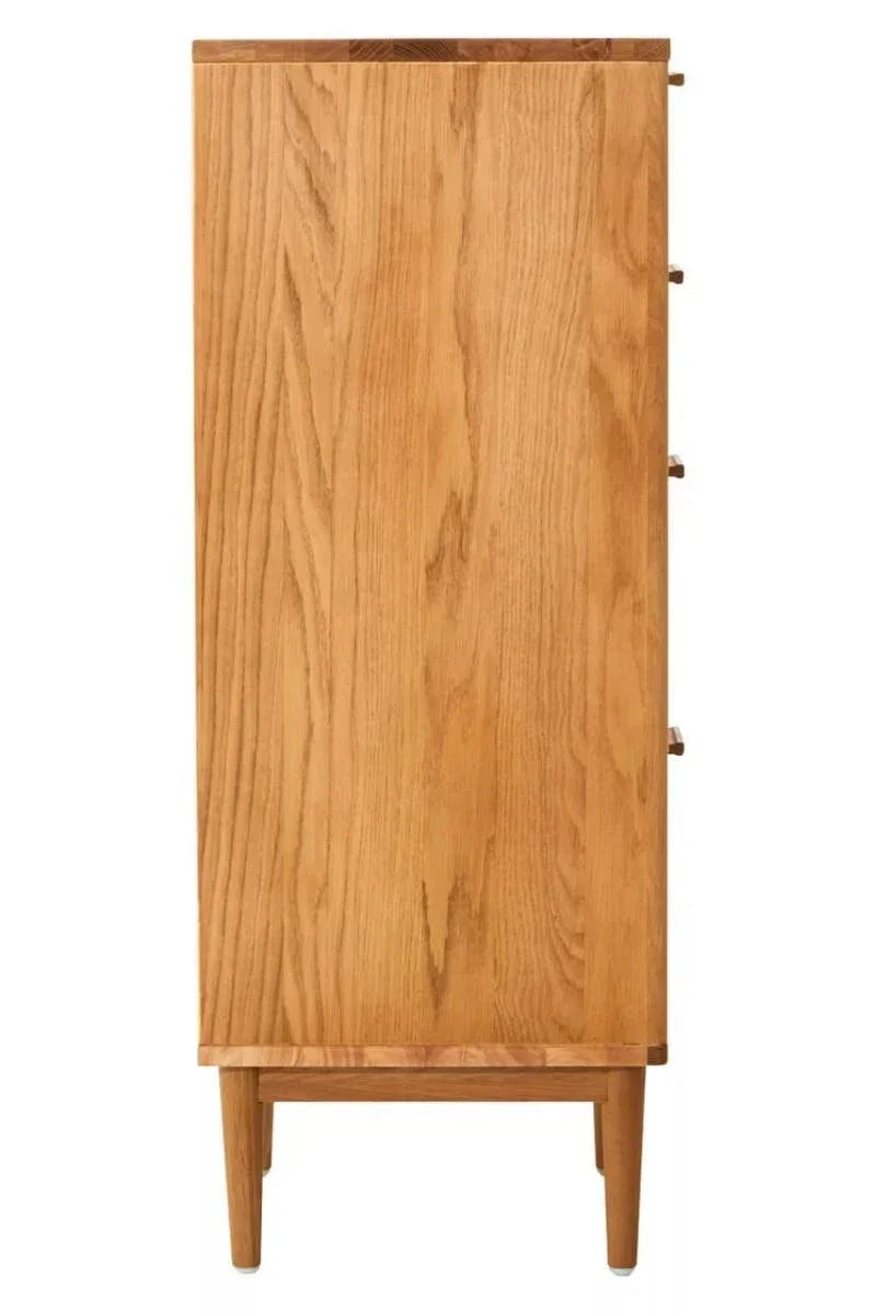Side view of oak chest of drawers with wooden legs