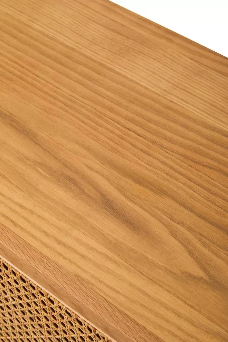 Oak wood sideboard surface with woven cane panel detail