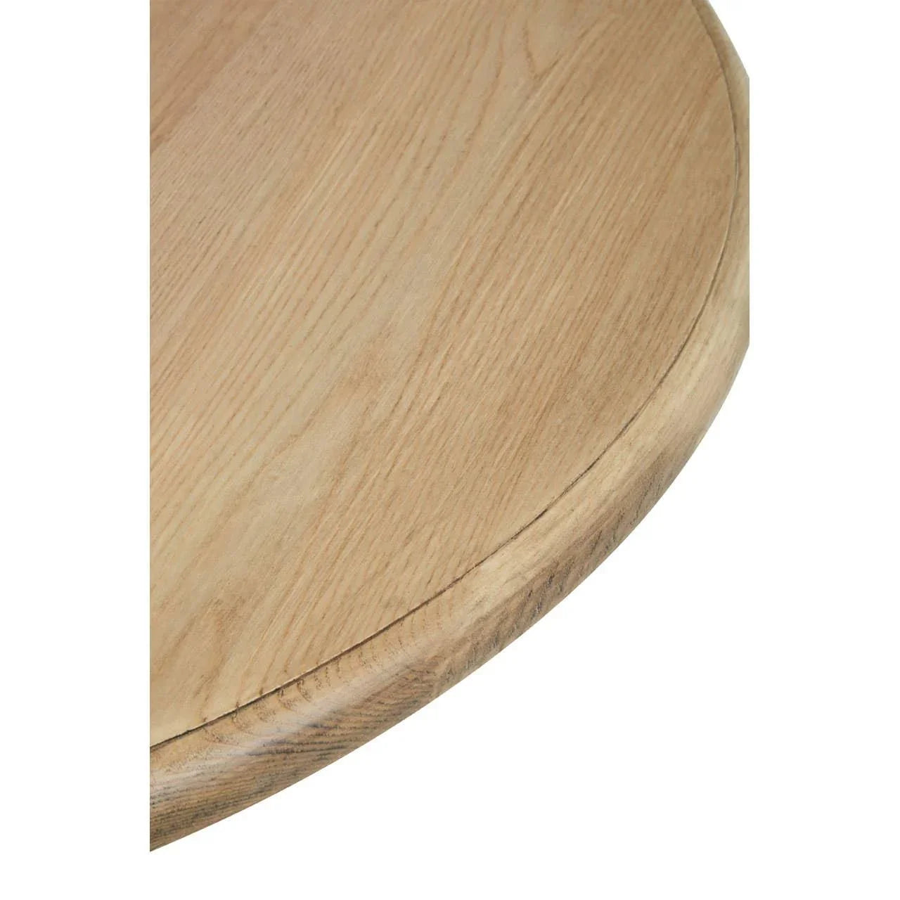 Close-up of round oak dining table top with natural wood grain texture