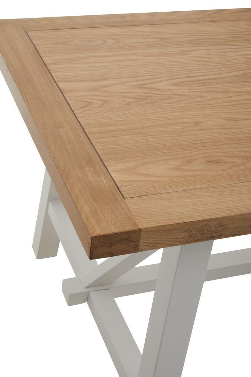 Oak dining table with white legs, close-up of tabletop and corner detail