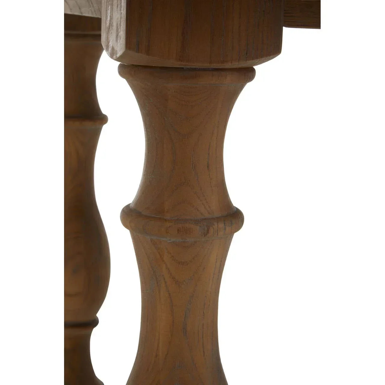 Close-up of wooden dining table leg with carved spindle detail